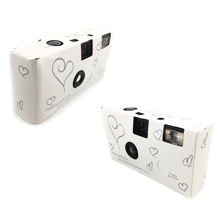 Alibaba wedding cameras; two white cameras with black hearts on them.
